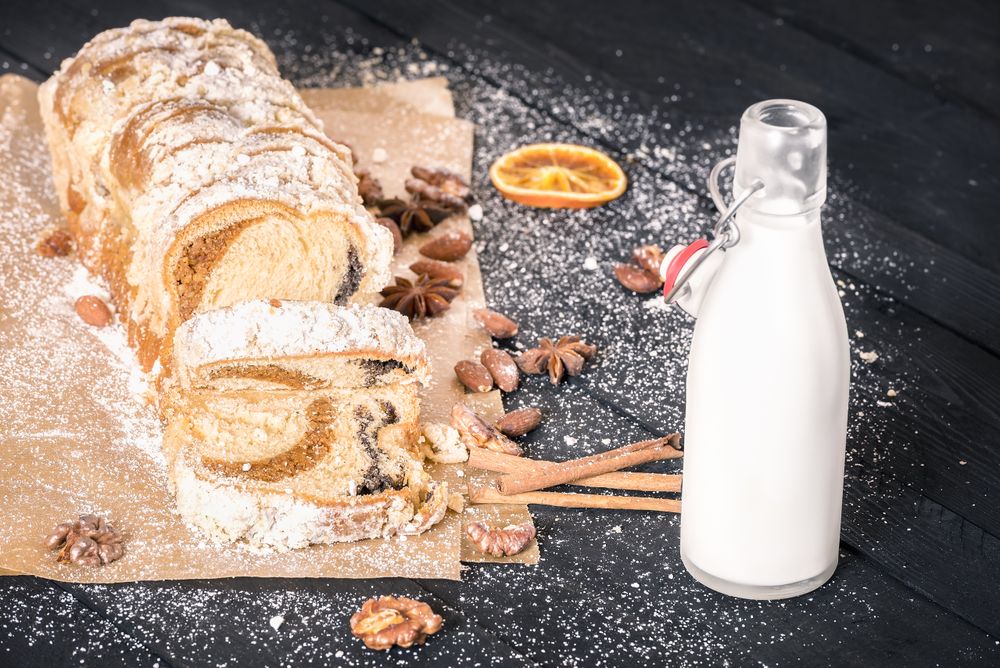 Sliced pound cake and a bottle of milk