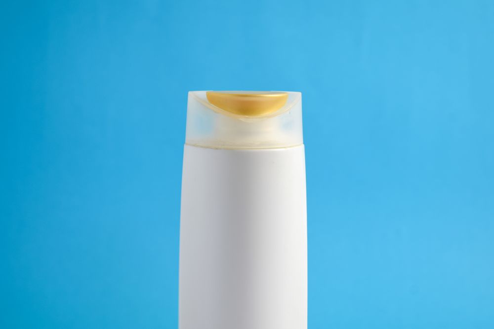 Top up of bottle of body wash in blue room