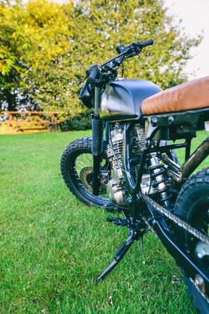 Custom motorcycle parked on the grass