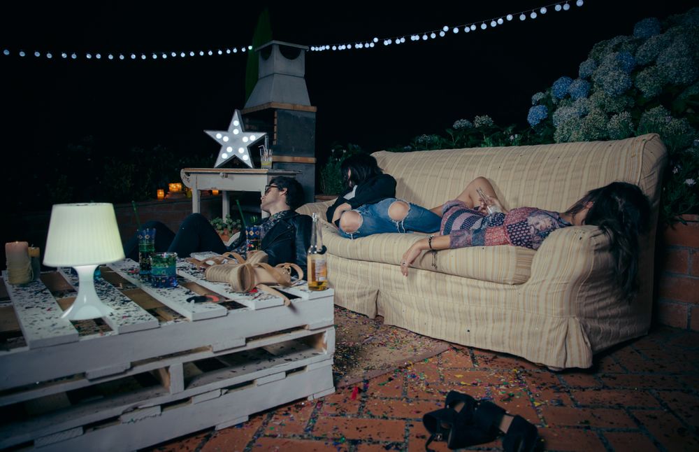 Group of friends lying around after a fun party