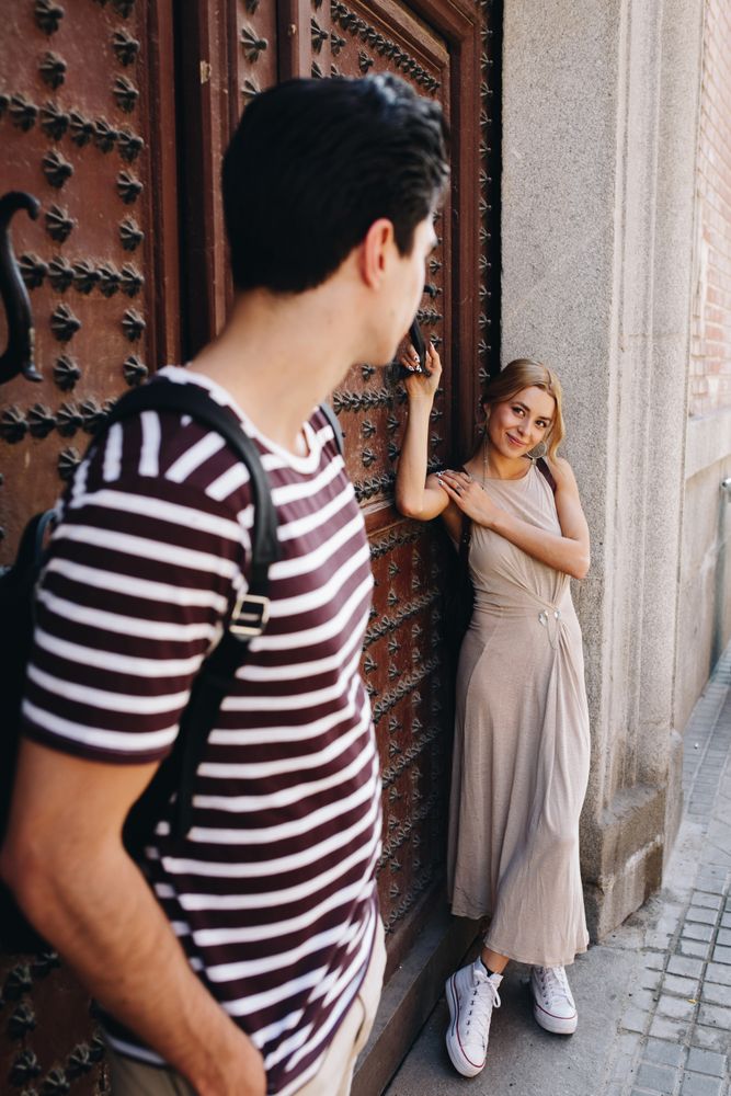 Happy couple having fun while walking in town