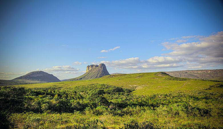 Butte above grassy field on nice day