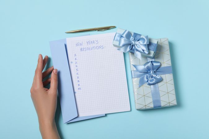 Concept of New Year Resolutions list, new year goals, top view