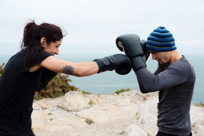 Boxers exercising on cliff
