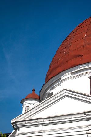 A Big red dome of church in Kota Lama, Semarang City, Indonesia. Vintage historical church blue sky background