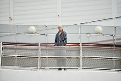 Stylish young man behind fence on ramp