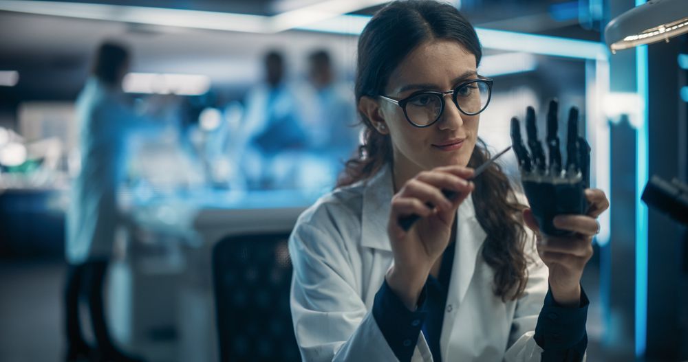 Young Female Scientist Working on a Prosthetic Robotic Hand.