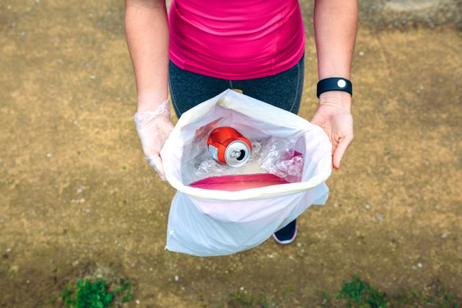 Woman showing garbage