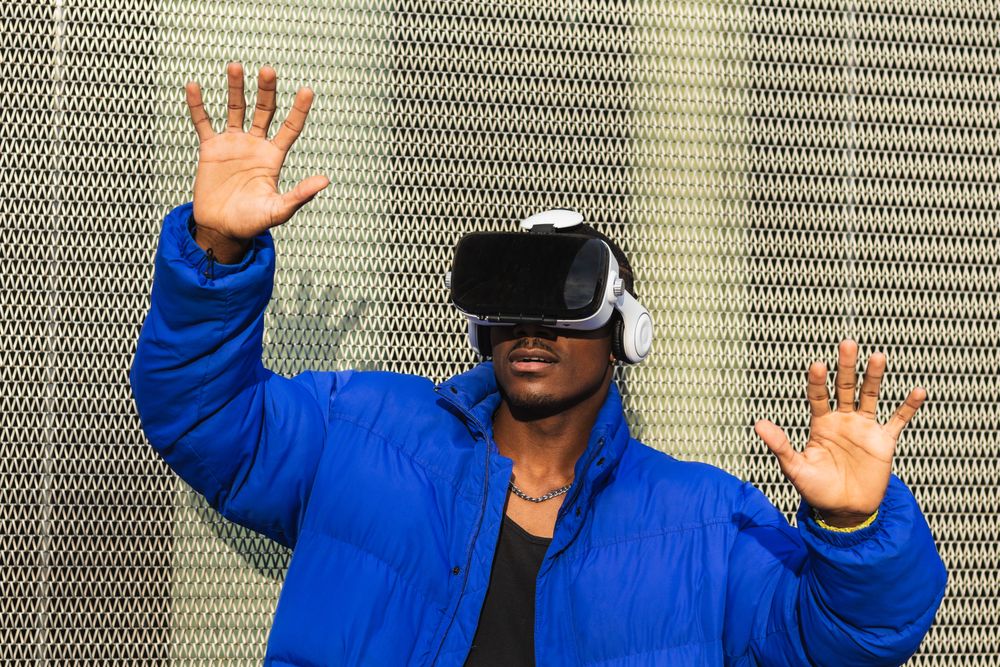 Black man experiencing virtual reality in city