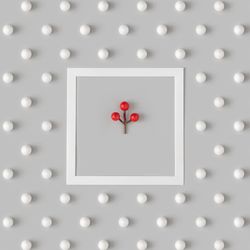 Holiday pattern with mistletoe berry and snowballs on gray background