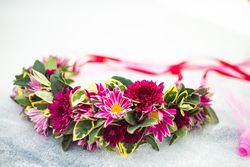 Head decor for woman with Aster flowers on marble background with copy space