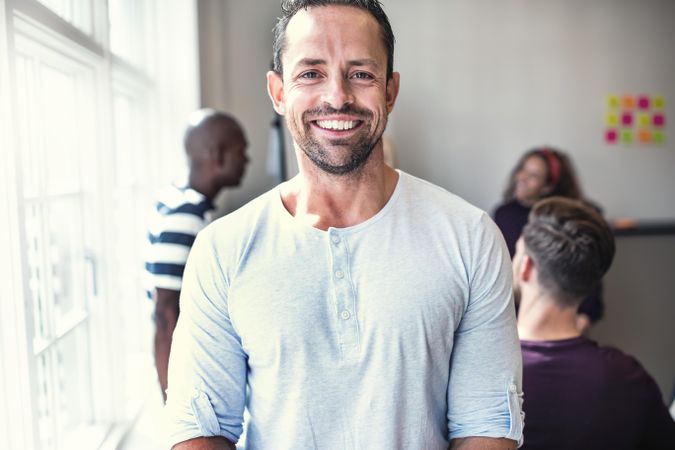 Man smiling in office