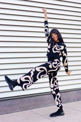 Dancer performing free style raising the leg in the street