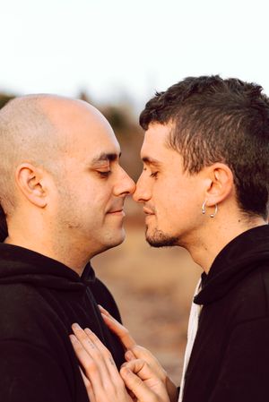 Men hugging in forest