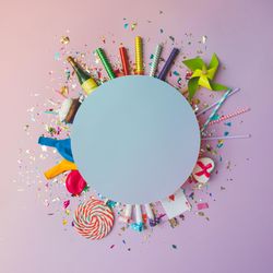 Party confetti, balloons, streamers, fireworks and decoration in circle