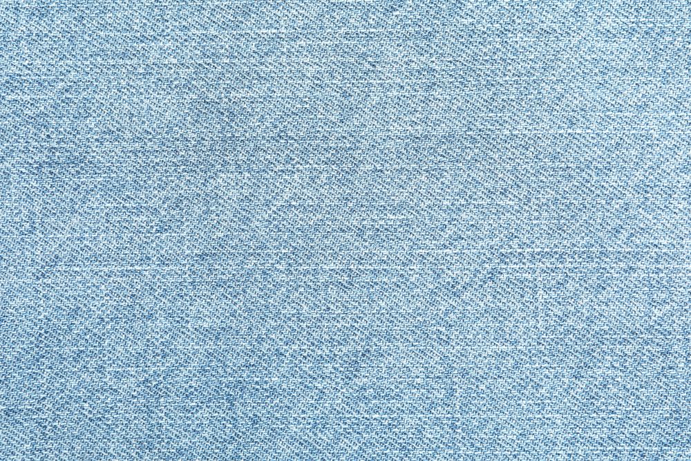 Texture of blue jeans as background, space for text