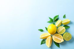 Flat lay composition with citrus on color background, space for text