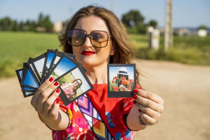 Young woman showing summer photos
