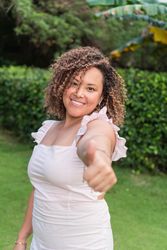 Portrait of smiling young woman with curly hair