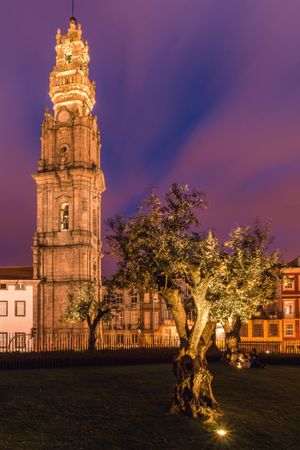 Old bell tower under majestic twilight sky