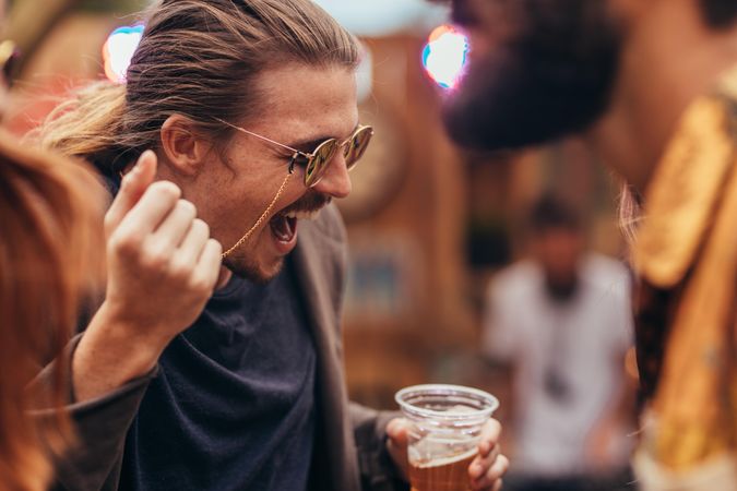 Male hipster having a great time at music festival