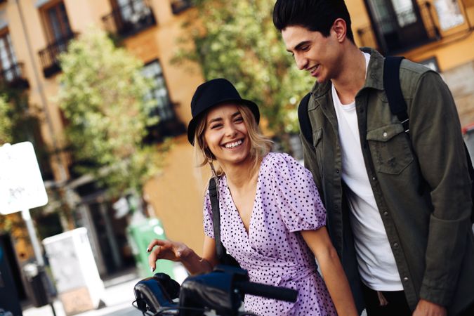 Happy couple having fun while walking in town