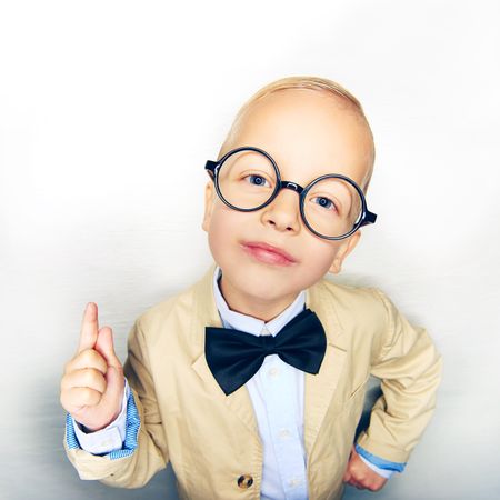 Insistent blond boy in glasses and bow tie