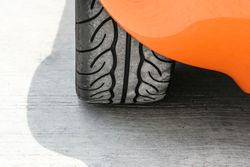 Close up of tire on orange car