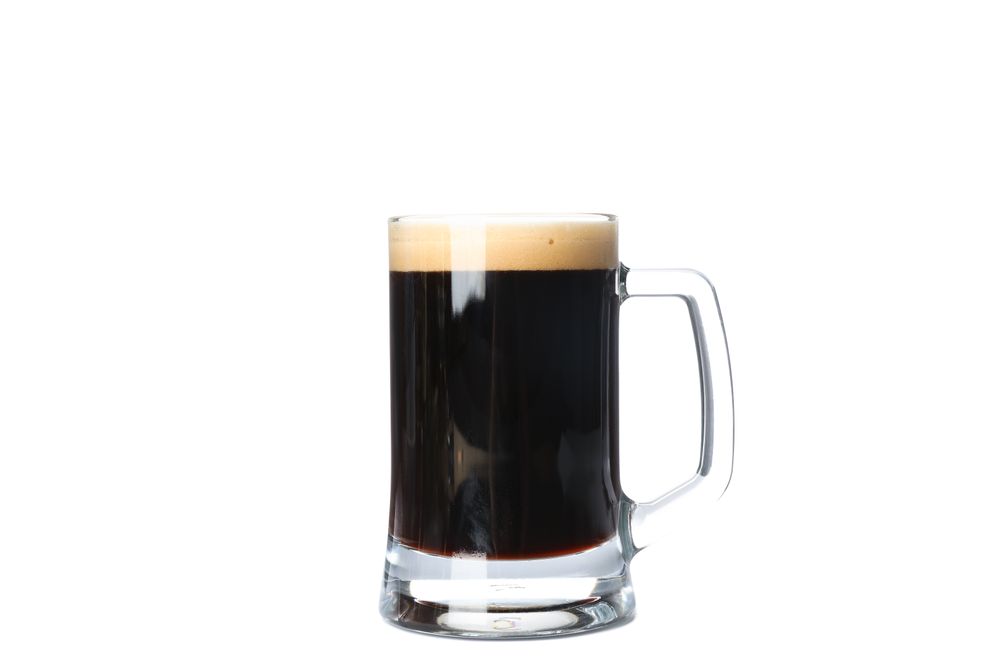 Glass of beer isolated on studio background