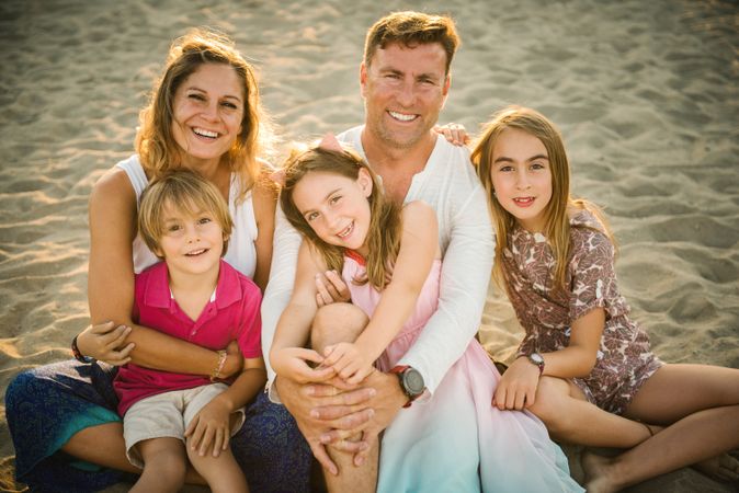 Beautiful happy family with children on beach
