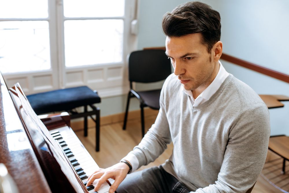 Man playing piano in studio