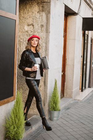 Woman with drink on the street