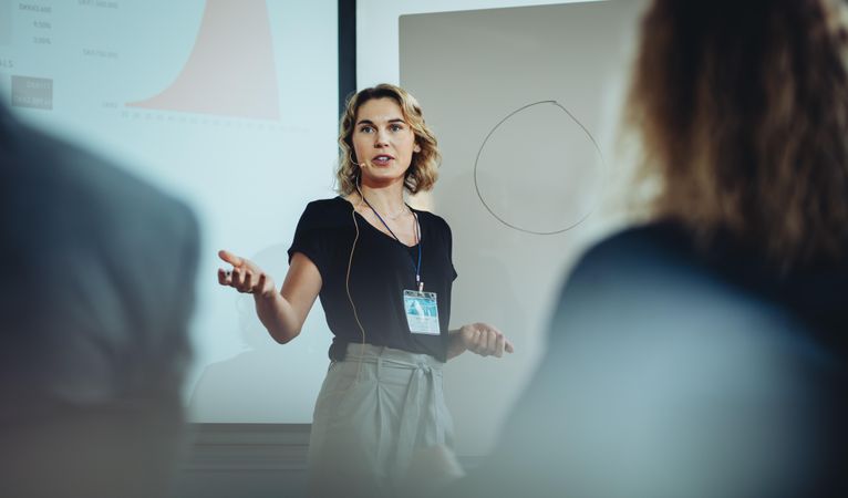 Woman presenting her idea to colleagues in meeting