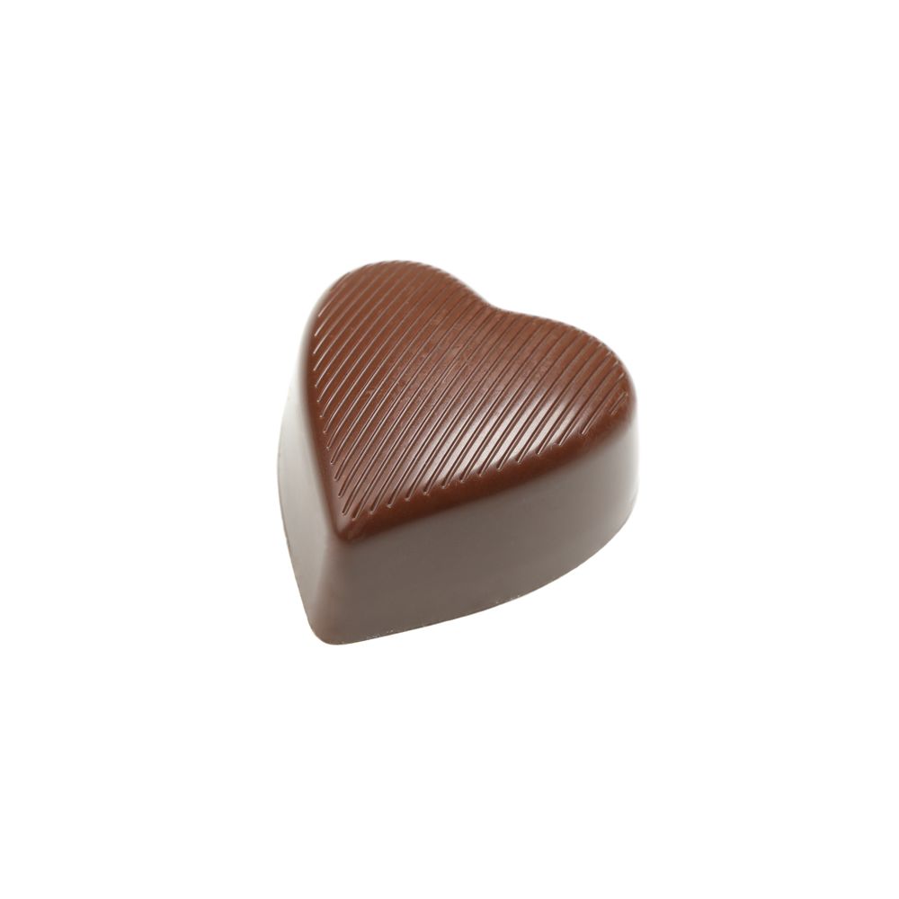 Tasty chocolate candy in the heart form isolated on studio background