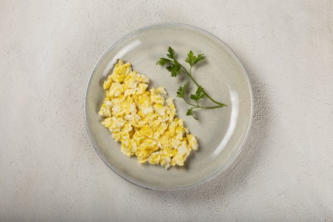 Breakfast with scrambled eggs on the table.