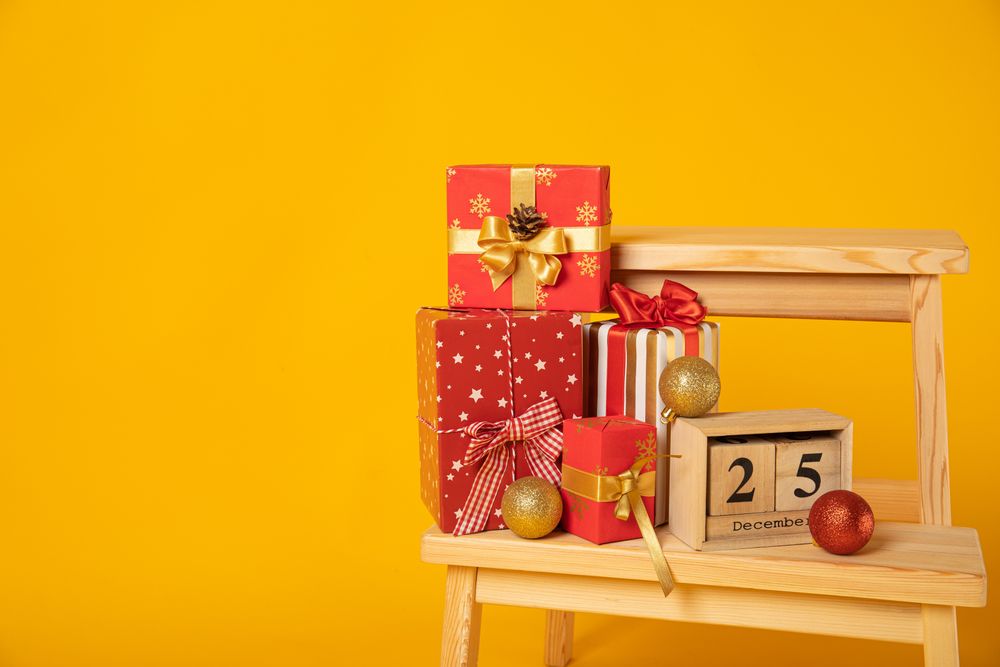 Concept of Merry Christmas, Christmas accessories on yellow background, space for text