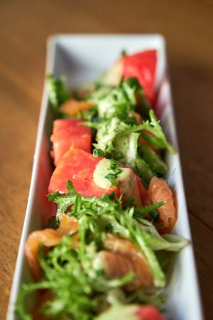 Marinated salmon with escarole salad and mustard sauce