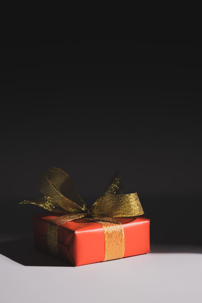 Red gift box on neutral background