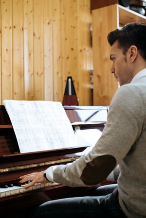 Man playing piano in studio