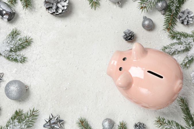 Concept of Christmas finance with piggy bank, space for text
