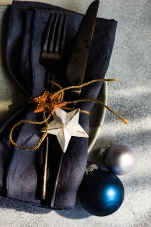 Christmas table setting with blue and silver baubles