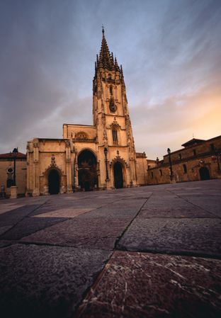 Old cathedral near hills and blue sky