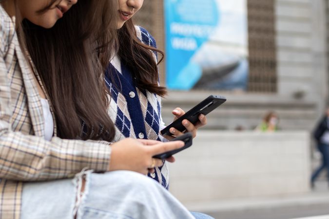 Young Asian women using smartphone in the city