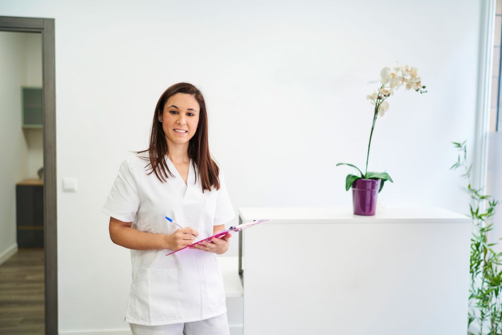 physiotherapist at the clinic's reception desk