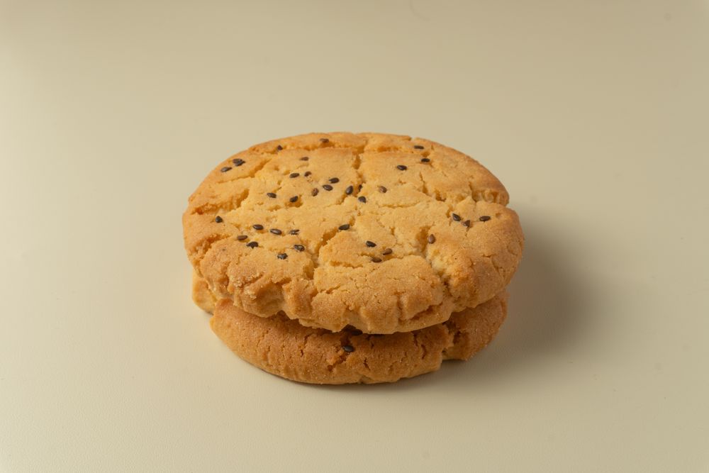 Sesame topped cookies arranged neatly