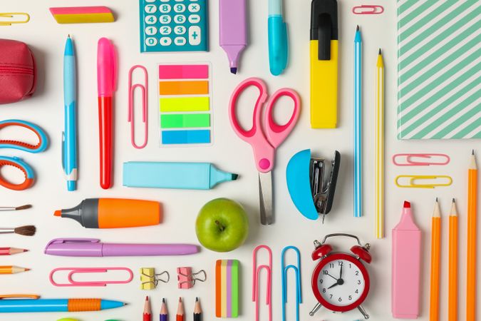 Flat lay with different school supplies on blank background