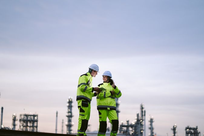 Engineer worker watching work monitor on digital tablet and checking at factory