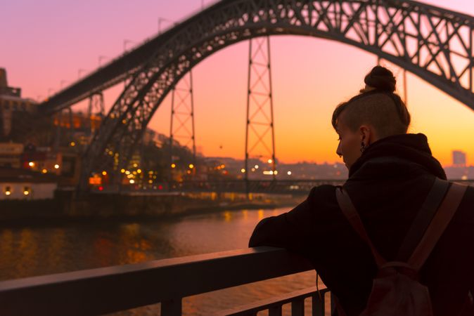 Female standing on embankment during sundown