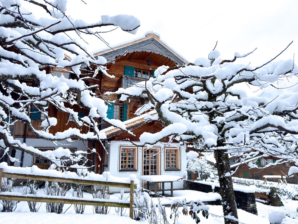 Traditional Swiss chalet in snowy Rougemont, VD