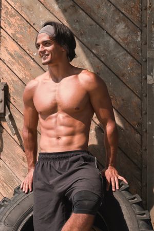 Muscular man posing in gym